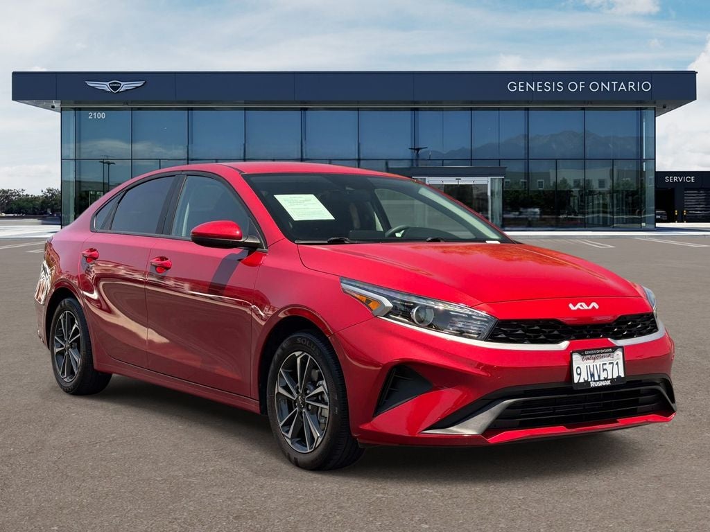 2024 Kia Forte LXS in Currant Red — front three-quarter view