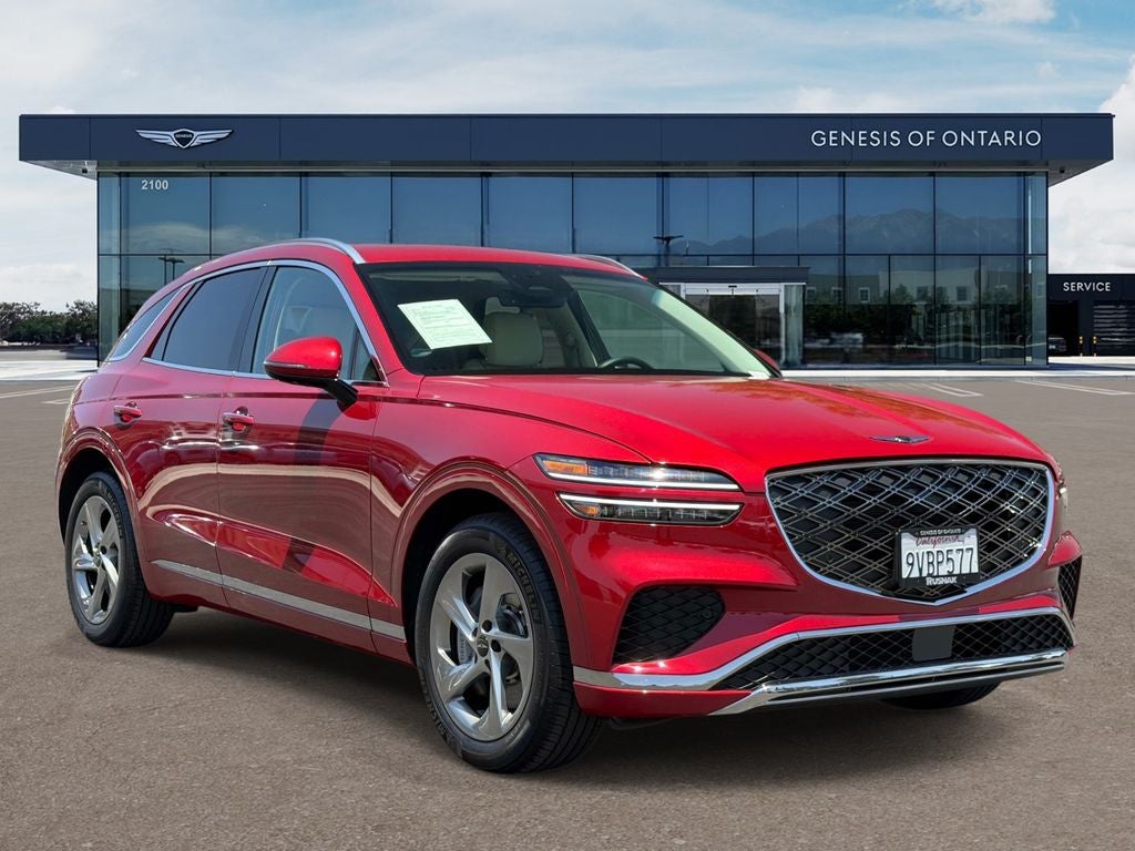 2026 Genesis GV70 2.5T Select in Mauna Red — front three-quarter view