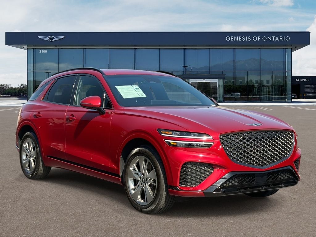 2024 Genesis GV70 3.5T Sport in Mauna Red — front three-quarter view