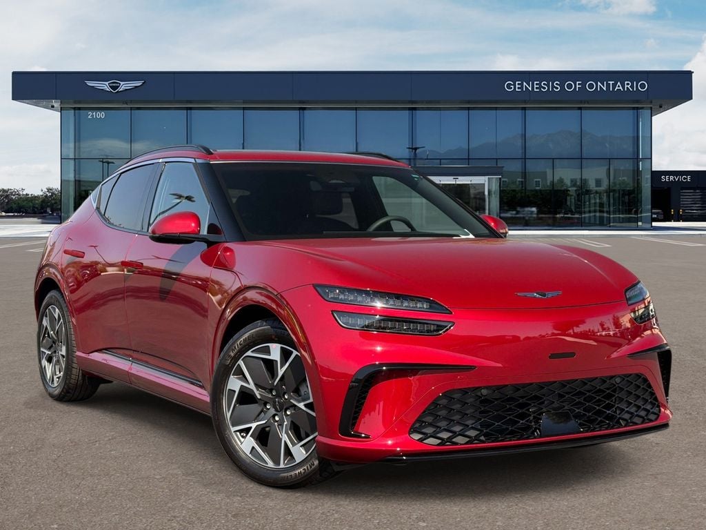 2026 Genesis GV60 STANDARD in Mauna Red — front three-quarter view