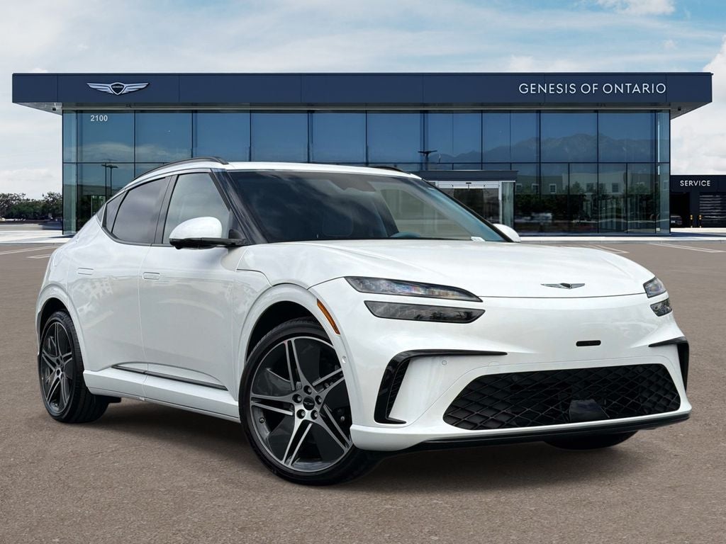 2026 Genesis GV60 PERFORMANCE in Uyuni White — front three-quarter view