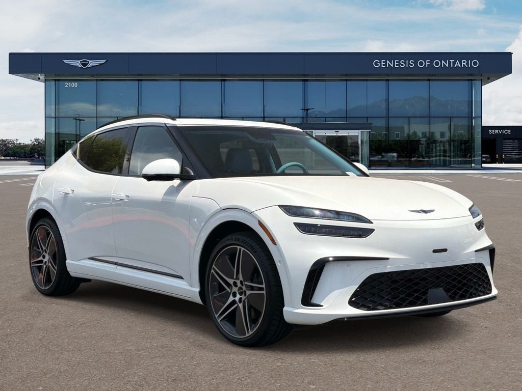 2026 Genesis GV60 PERFORMANCE in Uyuni White — front three-quarter view